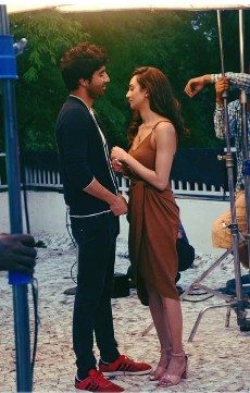 On set candid moment between takes