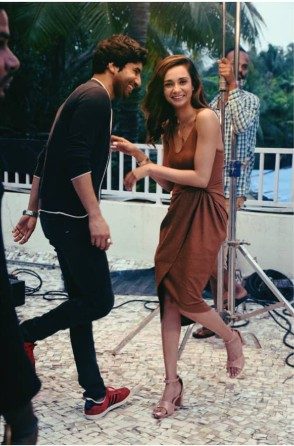 On set candid moment between takes